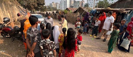 Mr. Evan Islam having a conversation the kids in Mirpur