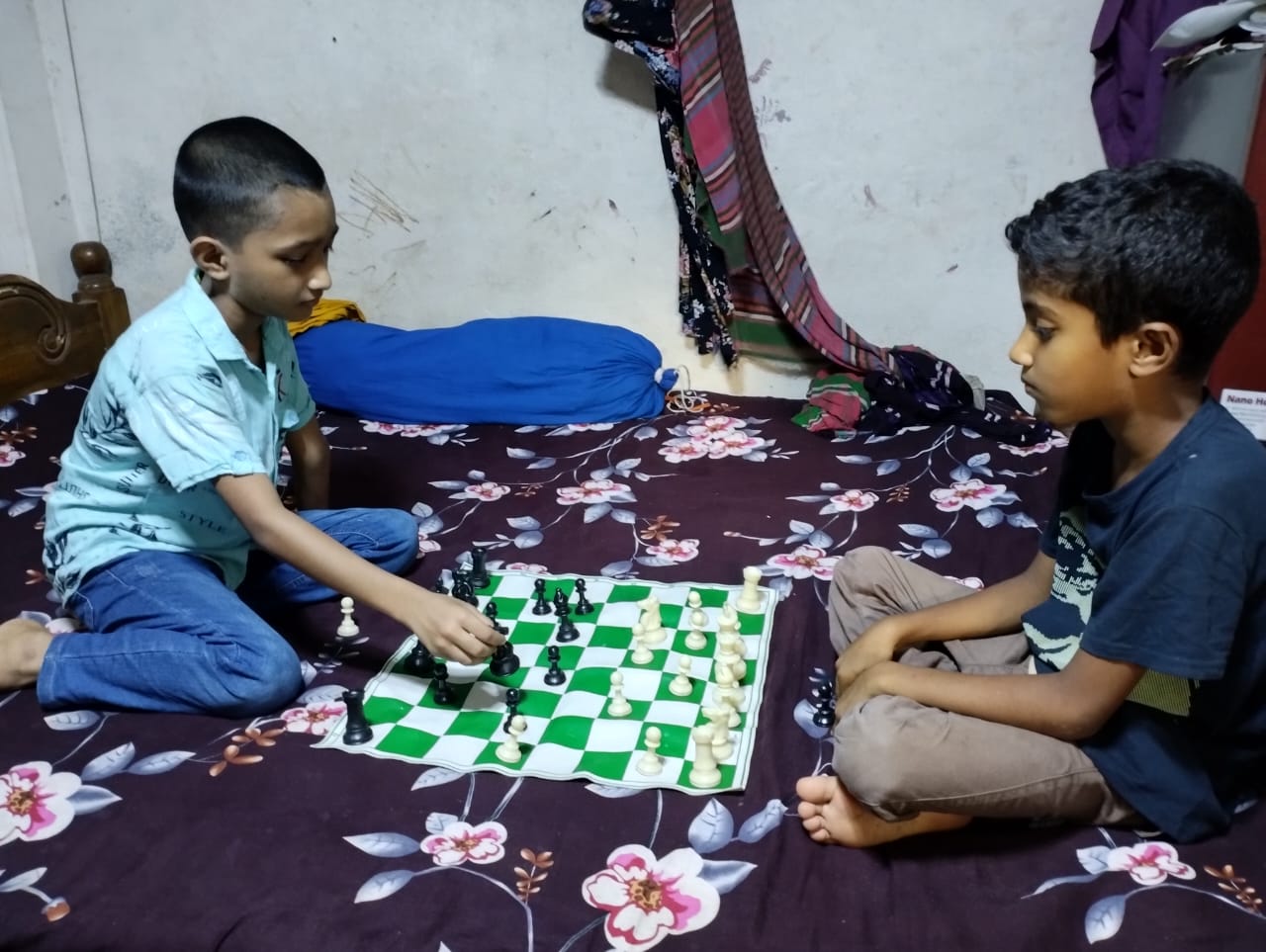 Abdullah and Romjan playing chess