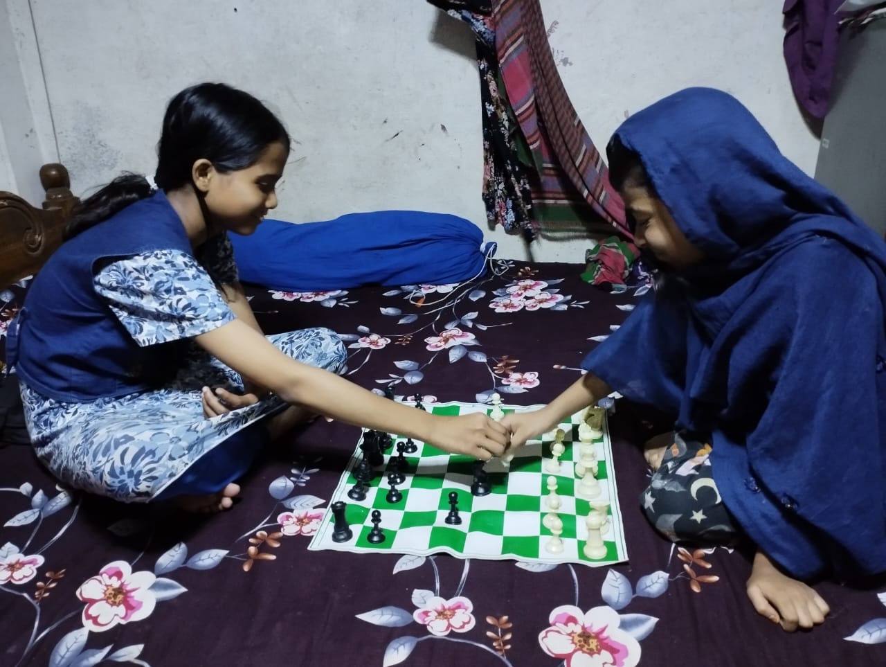 Lamia and Taiyeba playing chess