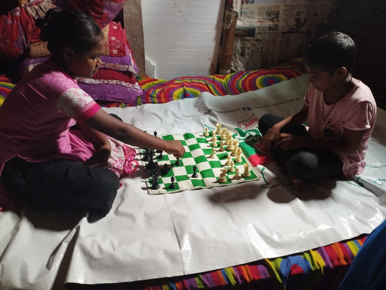Moriam and Nusrat playing chess