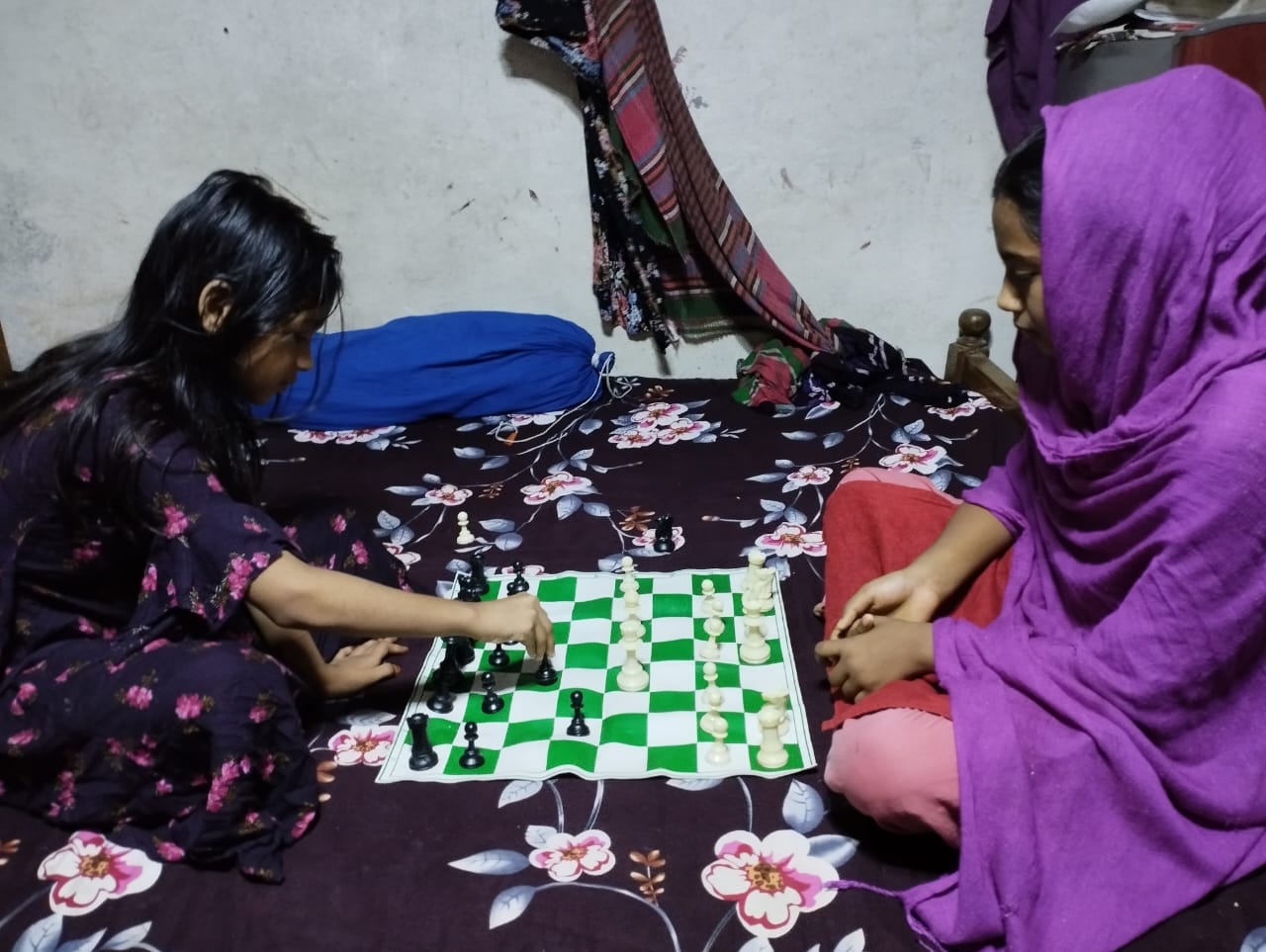 Munni and Synthia playing chess