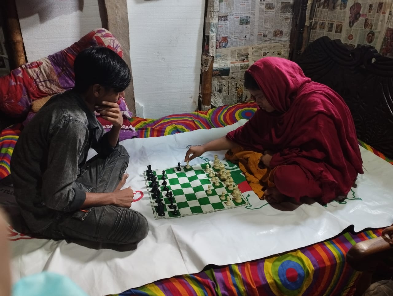 Nasrin and Shakil playing chess