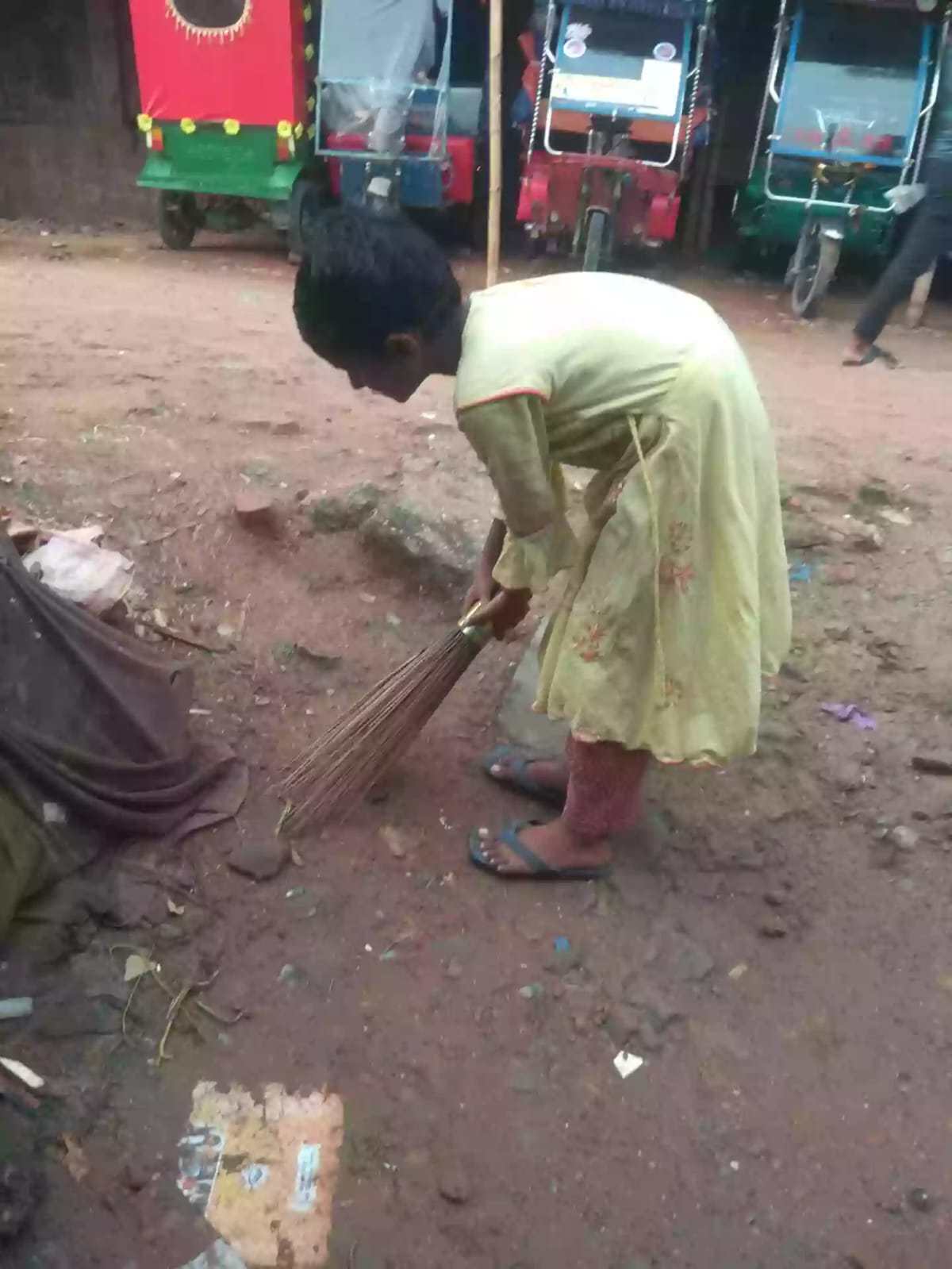 Hajera cleaning her neighborhood
