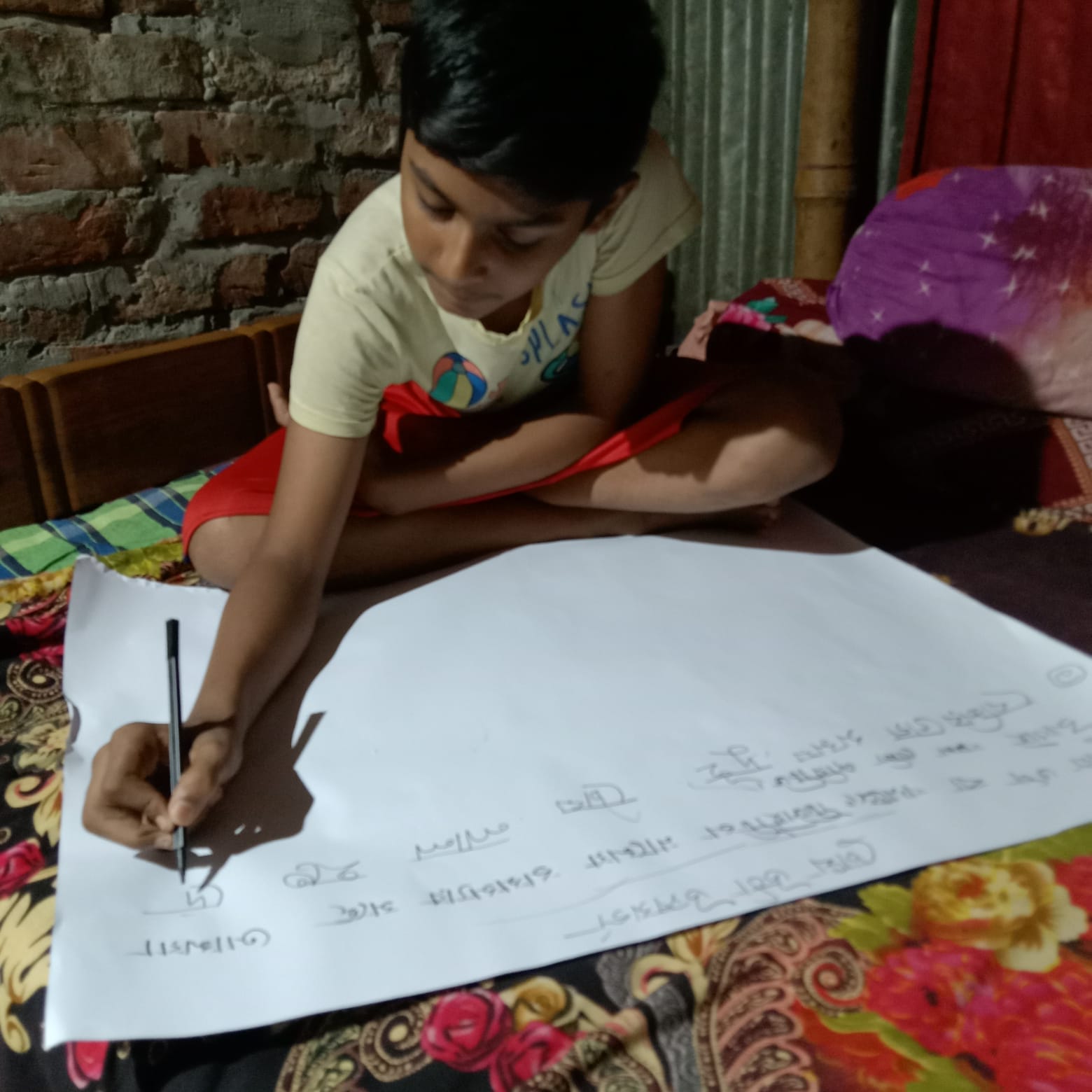 Jahid making a poster on conjunctivitis awareness