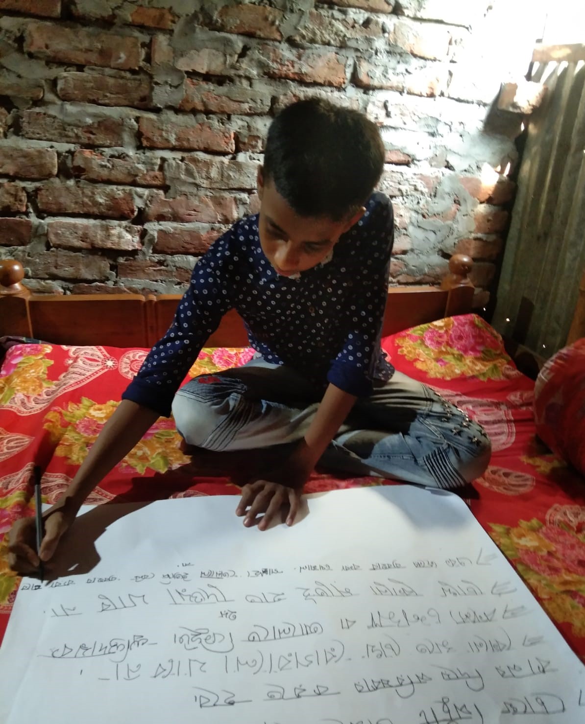 Kabir making a poster on conjunctivitis awareness