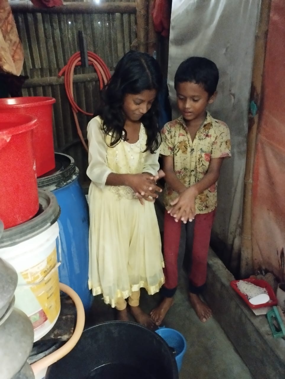 Abdur Rahman teaching other kids how to wash hands properly