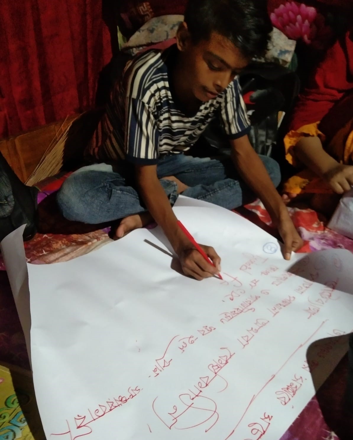Monir making a poster on typhoid awareness
