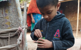 Abdur Rohman taking care of his plants