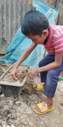 Abdur Rahman taking care of his plants