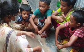 Children in Mirpur learning how to prepare soil for tree plantation