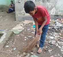 Ashadul cleaning the neighborhood