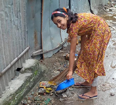Ayesha cleaning the neighborhood