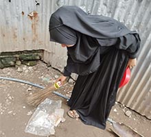 Boishakhi cleaning the neighborhood