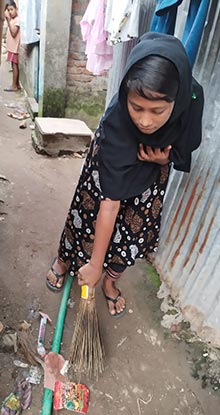 Brishti cleaning the neighborhood