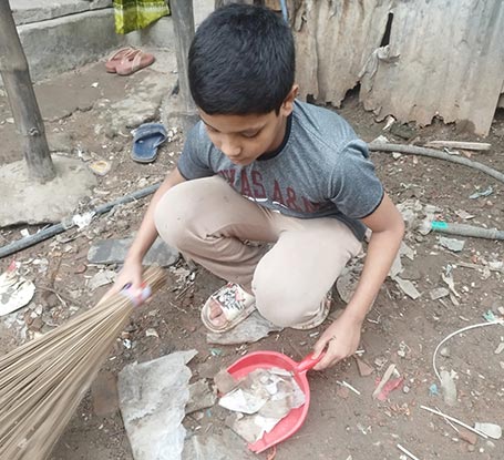 Hossain cleaning the neighborhood