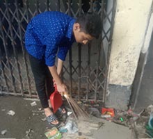 Rafi cleaning the neighborhood