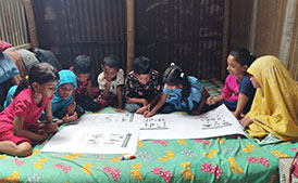 Kids in Mirpur making posters on thunderstorm awareness