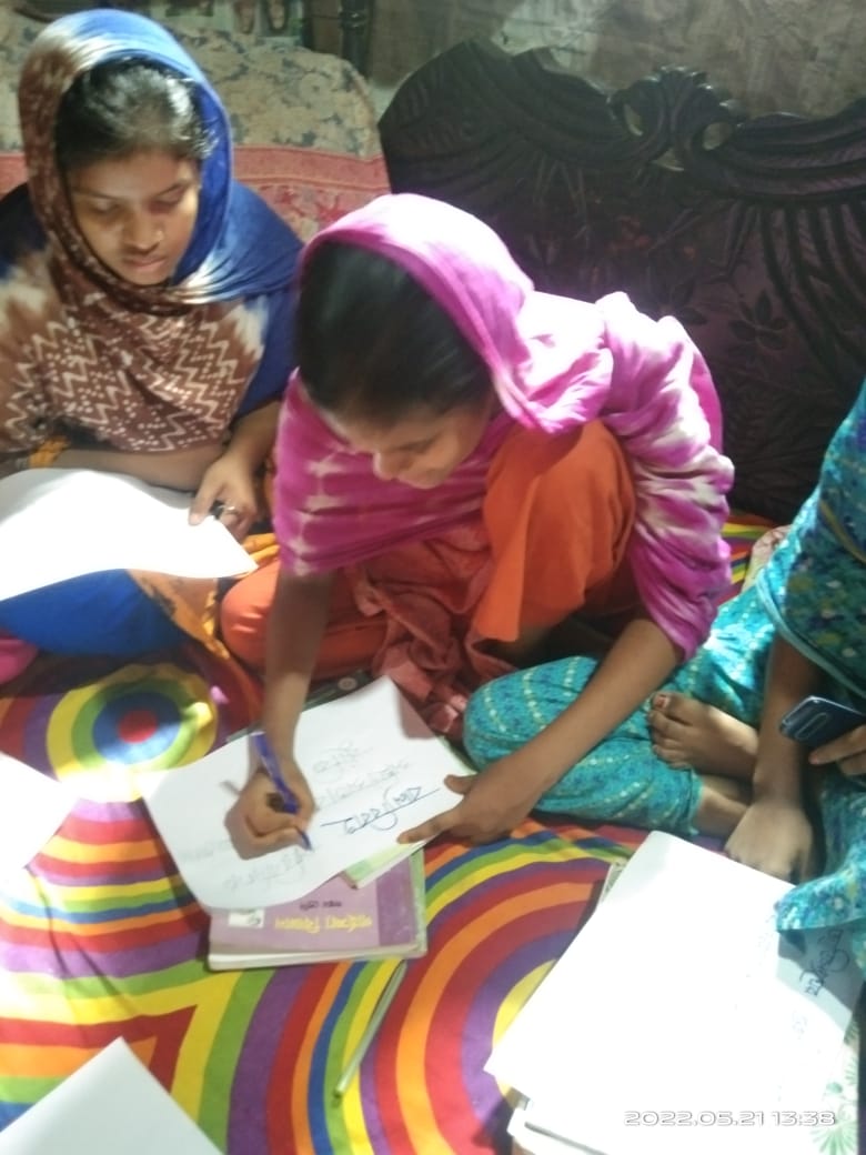 Lima making a poster on child marriage awareness