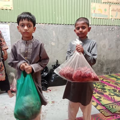 Rafan and Hesham received the meat from Shapla Foundation