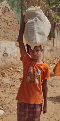 Kid carrying ramadan groceries