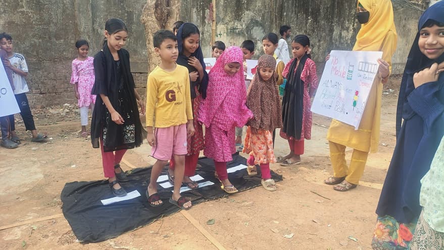 Kids in Mirpur in the road safety awareness program