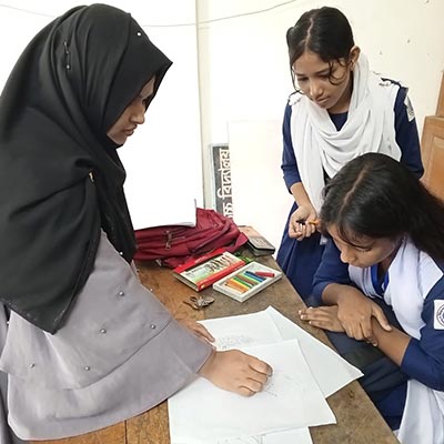 Habiba helped the kids in free hand drawing