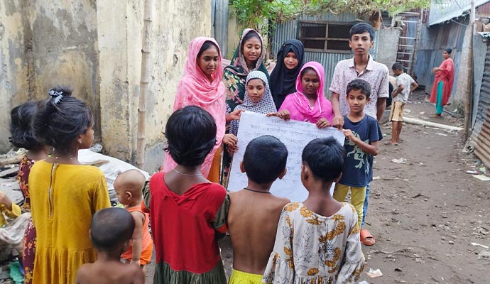 Students presenting an informational poster during an awareness against human trafficking session
