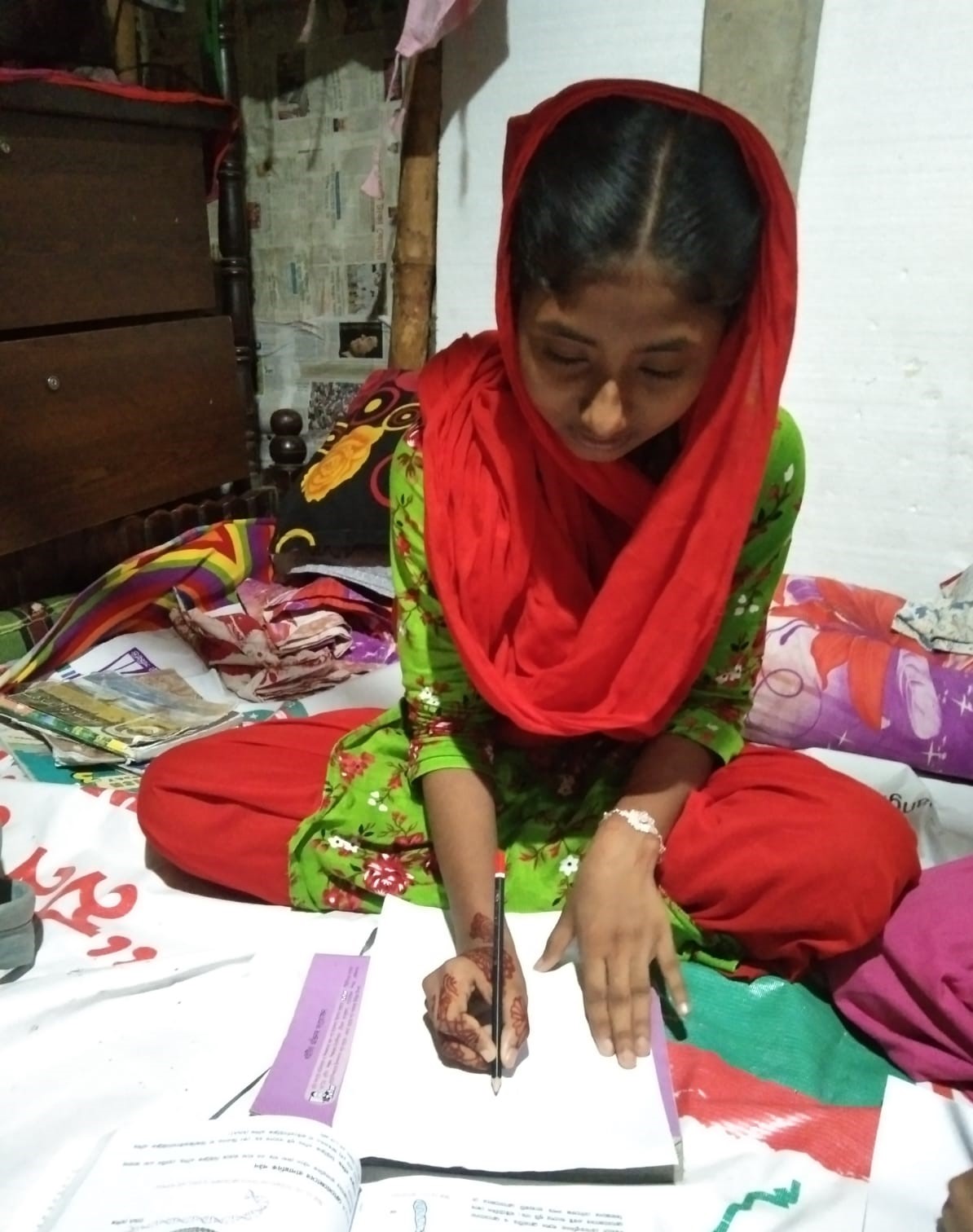 Moushumi Drawing a figure from her science book