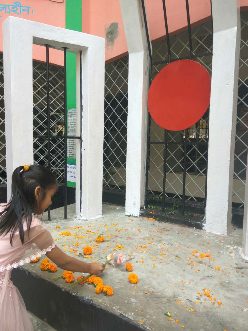 Synthia giving flower at Shahid Minar