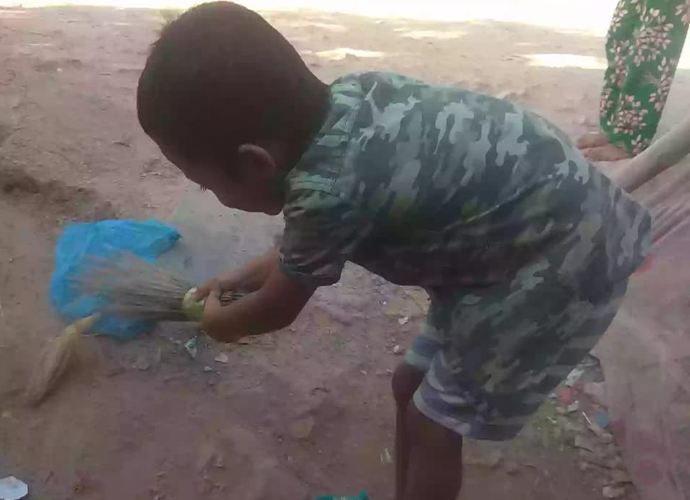 Rifat cleaning his neighborhood