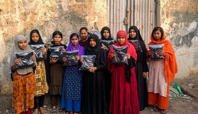 Shapla Foundation is distributing winter clothing packets for a project